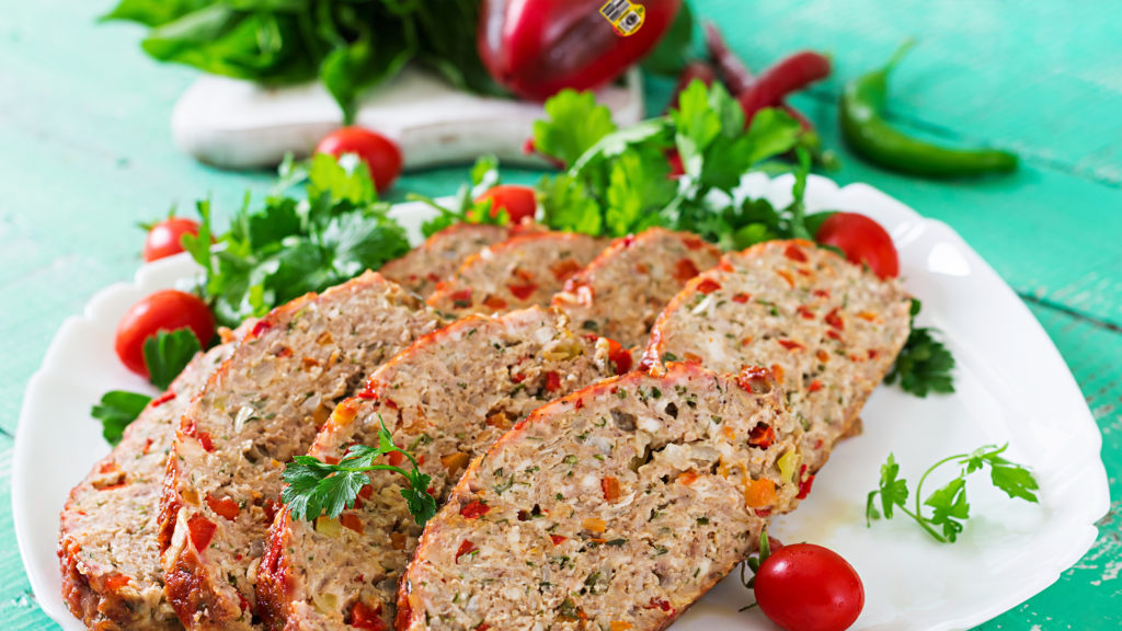 Meatloaf with ketchup and bell peppers